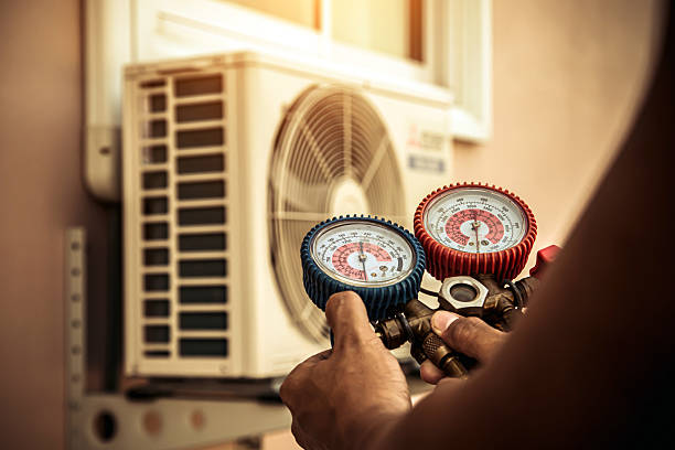 Professional Heat Pump Repair technician working in Mc Adenville, NC
